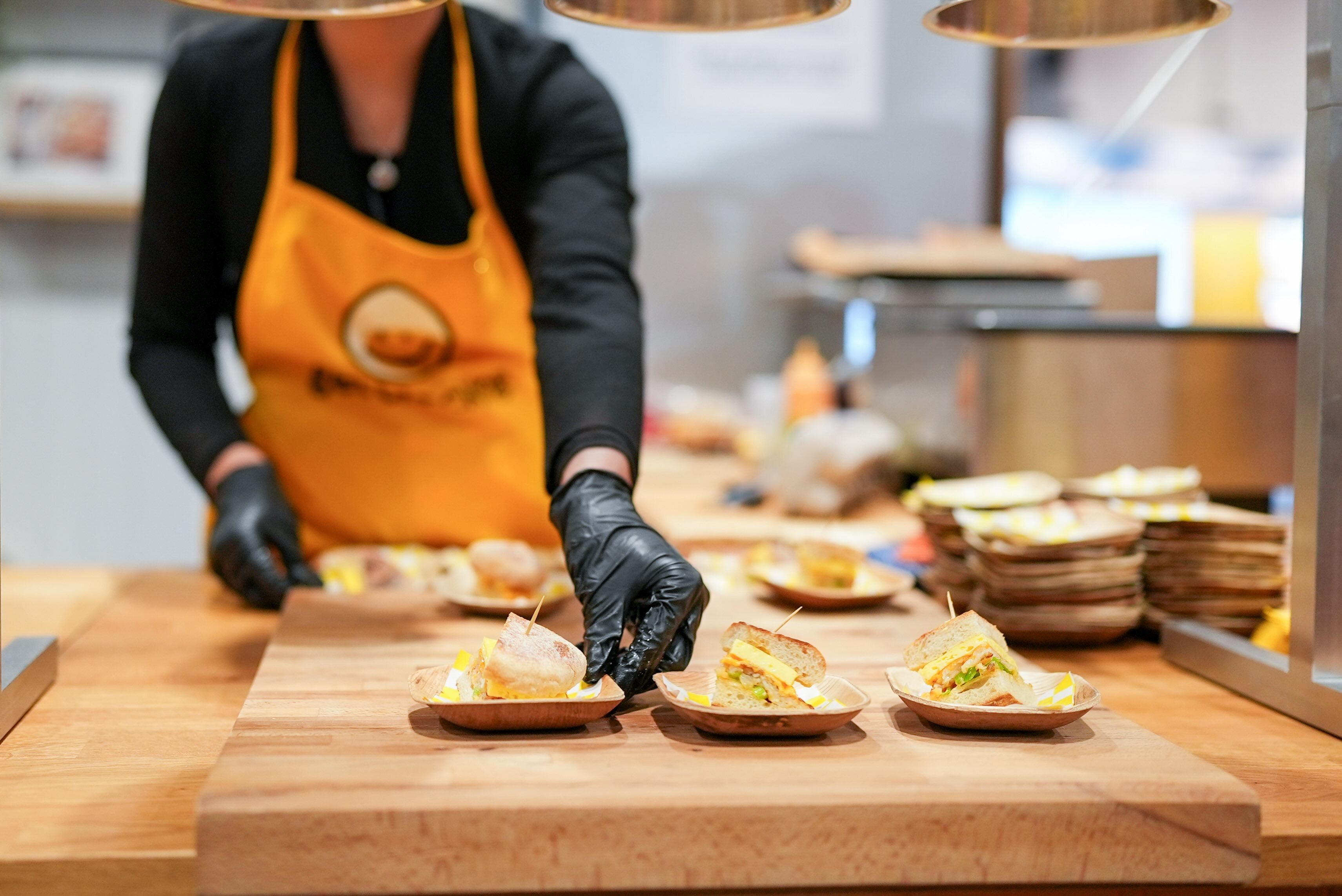 Setting out samples at a food trade show booth