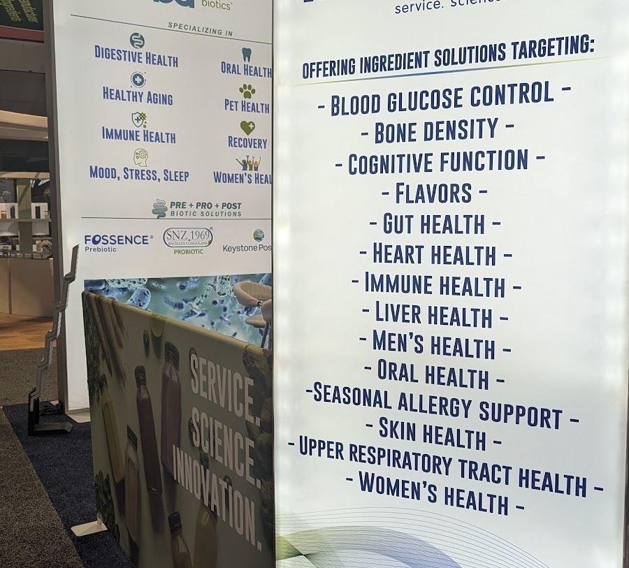 Signs at a trade show with long lists of solutions offered