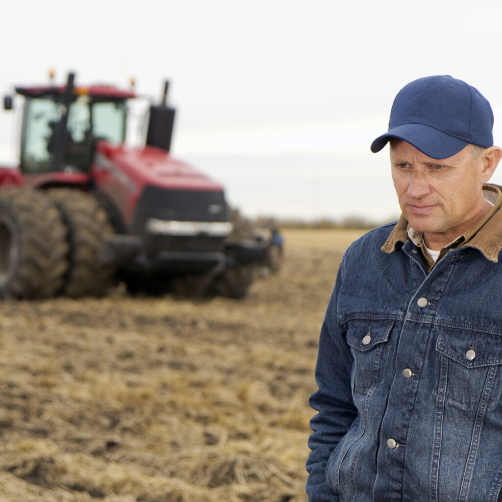 Pensive farmer in a field